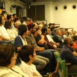 Paysage du Sistan‑et‑Baloutchistan en Iran, montrant des habitations traditionnelles et un environnement aride symbolisant l’isolement de la minorité baloutche.