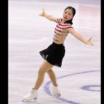 Portrait d’Ami Nakai exécutant une figure sur glace lors des Jeux olympiques 2026, illustrant son style précis et la montée en puissance du patinage japonais.