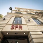 Illustration montrant les logos d’Orange, Bouygues Telecom, Iliad et SFR, symbolisant les négociations complexes autour du rachat et du démantèlement de SFR en 2026.